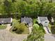 Aerial view of the home surrounded by mature trees and landscaped yard at 108 Braxberry Way, Holly Springs, NC 27540