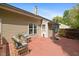Back deck features chairs, a table and a large umbrella at 108 Braxberry Way, Holly Springs, NC 27540