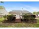 Exterior backyard view featuring a deck with stairs, trimmed hedges and fenced yard at 108 Braxberry Way, Holly Springs, NC 27540