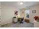 Study featuring neutral colors, natural light, and a cozy desk area at 108 Braxberry Way, Holly Springs, NC 27540