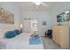 Bright and airy bedroom with plush carpet, soft blue walls, and a TV with media at 108 Braxberry Way, Holly Springs, NC 27540