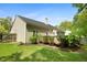 View of the exterior of the home with a small deck and a fenced yard at 108 Braxberry Way, Holly Springs, NC 27540