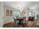 Cozy eat-in kitchen area featuring a table with seating for four and bright natural light at 108 Braxberry Way, Holly Springs, NC 27540