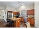Stylish kitchen featuring an island, stainless steel appliances, and warm wooden cabinetry at 108 Braxberry Way, Holly Springs, NC 27540