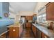 Modern kitchen with granite countertops, stainless steel appliances, and a cozy dining area at 108 Braxberry Way, Holly Springs, NC 27540