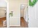 Welcoming foyer with wood floors, neutral walls, and a view into the hallway at 12 Poppy Trl, Durham, NC 27713