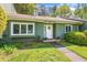 Charming single-story home with a well-manicured lawn and welcoming front entrance at 12 Poppy Trl, Durham, NC 27713