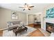 Cozy living room featuring hardwood floors, fireplace, and stylish furnishings, perfect for relaxation and entertainment at 12 Poppy Trl, Durham, NC 27713