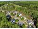 Aerial view of a residential neighborhood surrounded by lush greenery at 12808 Edsel Dr, Raleigh, NC 27613