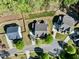 Aerial shot showcases homes with manicured lawns and mature trees in a planned neighborhood setting at 12808 Edsel Dr, Raleigh, NC 27613