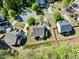 Overhead view of a property featuring a well-manicured lawn, mature trees, and a neatly arranged neighborhood layout at 12808 Edsel Dr, Raleigh, NC 27613