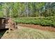 Well-maintained backyard with a deck and landscaped area at 12808 Edsel Dr, Raleigh, NC 27613