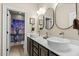 Bathroom with dual vessel sinks and a unique shower curtain at 12808 Edsel Dr, Raleigh, NC 27613
