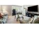 Spacious bonus room with carpet, sitting area, and TV at 12808 Edsel Dr, Raleigh, NC 27613