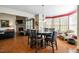Cozy breakfast nook with hardwood floors, large windows, and stylish pendant lighting at 12808 Edsel Dr, Raleigh, NC 27613