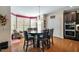 Inviting dining room with hardwood floors, a bay window, and a charming chandelier at 12808 Edsel Dr, Raleigh, NC 27613