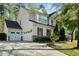 Elegant home featuring a three-car garage, stone accents, and well-maintained landscaping adding to its curb appeal at 12808 Edsel Dr, Raleigh, NC 27613