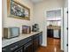 Kitchenette with granite countertops, dark cabinets, and stainless steel appliances at 12808 Edsel Dr, Raleigh, NC 27613