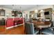 Open concept kitchen with granite countertops, stainless steel appliances, and adjacent dining area at 12808 Edsel Dr, Raleigh, NC 27613
