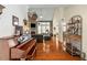 Spacious living room featuring hardwood floors, stone fireplace, and an open layout at 12808 Edsel Dr, Raleigh, NC 27613
