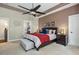 Serene main bedroom with neutral tones, tray ceiling, and comfortable furnishings at 12808 Edsel Dr, Raleigh, NC 27613