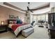Spacious main bedroom with tray ceiling and large windows, and a relaxing sitting area at 12808 Edsel Dr, Raleigh, NC 27613