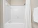 Bathroom features shower and tub combination with white tile and updated fixtures at 1312 Rothes Rd, Cary, NC 27511