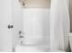 Bathroom featuring tub and shower combo with white subway tile at 1312 Rothes Rd, Cary, NC 27511