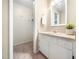 Bathroom featuring sink, vanity, tile floors, and access to a closet for storage at 1312 Rothes Rd, Cary, NC 27511