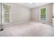 Cozy bedroom with natural light and two large windows offers a bright space at 1312 Rothes Rd, Cary, NC 27511