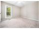 Comfortable bedroom featuring neutral paint, carpet, and a ceiling fan at 1312 Rothes Rd, Cary, NC 27511