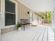 Inviting front porch with a bench and white railing, perfect for relaxing outdoors at 1312 Rothes Rd, Cary, NC 27511