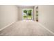 Bright living room with sliding glass door to the backyard and neutral decor at 1312 Rothes Rd, Cary, NC 27511