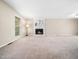 Spacious living room featuring a decorative fireplace and ample natural light at 1312 Rothes Rd, Cary, NC 27511