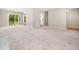 Open-concept living area with sliding glass doors to the backyard and neutral decor at 1312 Rothes Rd, Cary, NC 27511