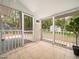 Relaxing screened porch with tile flooring and a view of the backyard at 1312 Rothes Rd, Cary, NC 27511