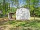Well-maintained storage shed in a private backyard with crossbuck doors at 1312 Rothes Rd, Cary, NC 27511