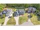 Aerial view of a home with long driveway, landscaped front yard, large fenced backyard at 133 Aleah Ct, Clayton, NC 27520