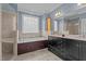 Elegant bathroom with a soaking tub, a double vanity, and a separate shower at 133 Aleah Ct, Clayton, NC 27520