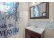 Cozy bathroom featuring a stylish vanity, framed mirror, and decorative shower curtain at 133 Aleah Ct, Clayton, NC 27520