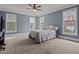 Bright bedroom with neutral paint, plush carpet, and plentiful windows for natural light at 133 Aleah Ct, Clayton, NC 27520
