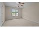 Bright bedroom with a ceiling fan and natural light streaming through the window at 133 Aleah Ct, Clayton, NC 27520