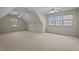 Large room with large windows, ceiling fans, and plenty of natural light at 133 Aleah Ct, Clayton, NC 27520