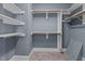 Walk-in closet with built-in shelving and rods, maximizing storage and organization at 133 Aleah Ct, Clayton, NC 27520