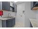 Well-equipped laundry room with ample counter space and cabinet storage at 133 Aleah Ct, Clayton, NC 27520