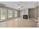 Bright living room featuring a cozy fireplace, neutral color palette, and natural light at 133 Aleah Ct, Clayton, NC 27520