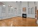Bright living room with hardwood floors, fireplace, built-in shelving, and large windows at 133 Aleah Ct, Clayton, NC 27520