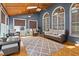 Cozy sunroom with ample natural light, comfortable seating, and stylish decor at 133 Aleah Ct, Clayton, NC 27520