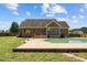 A lovely backyard features a swimming pool and deck perfect for outdoor entertaining at 140 Adams Pointe Ct Ct, Angier, NC 27501