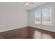 Bright bedroom with hardwood floors, a ceiling fan, and large windows that offer natural light at 140 Adams Pointe Ct Ct, Angier, NC 27501